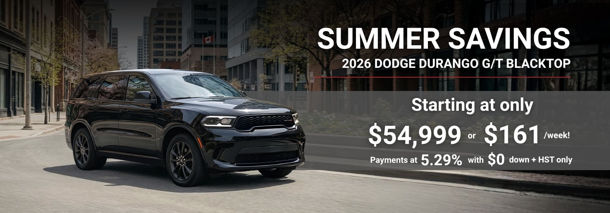 2026 Dodge Durango G/T Blacktop in urban setting, summer savings offer starting at $54,999 or $161/week.