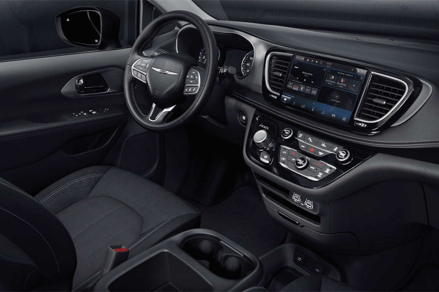 2025 Chrysler Grand Caravan interior dashboard with digital instrument cluster, touchscreen infotainment system, and modern center console layout
