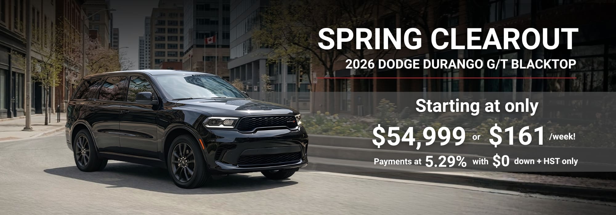 2026 Dodge Durango G/T Blacktop on city street with spring sale details: $54,999 or $161/week.